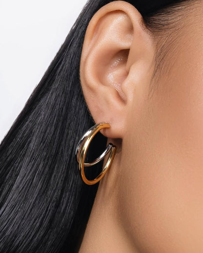 Xanthe Duo Hoops – gold and silver two-tone hoop earrings on white background