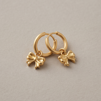 CHLOE Bow Charm Huggie Hoop Earrings lifestyle shot